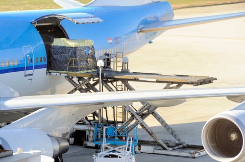 cargo being loaded onto an airplane